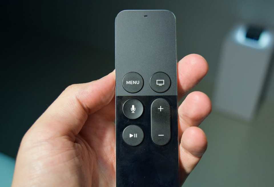 A photo of the Apple TV remote, which has a gesture-friendly touch pad and only six buttons.